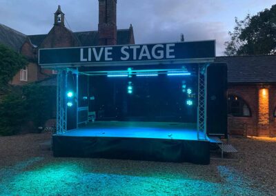Slick Staging: multi-purpose stage for outdoor festival-style wedding